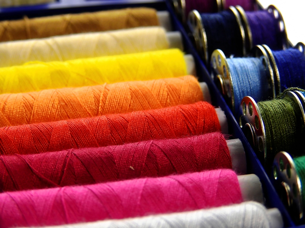 Colorful thread spools wound on paper cores